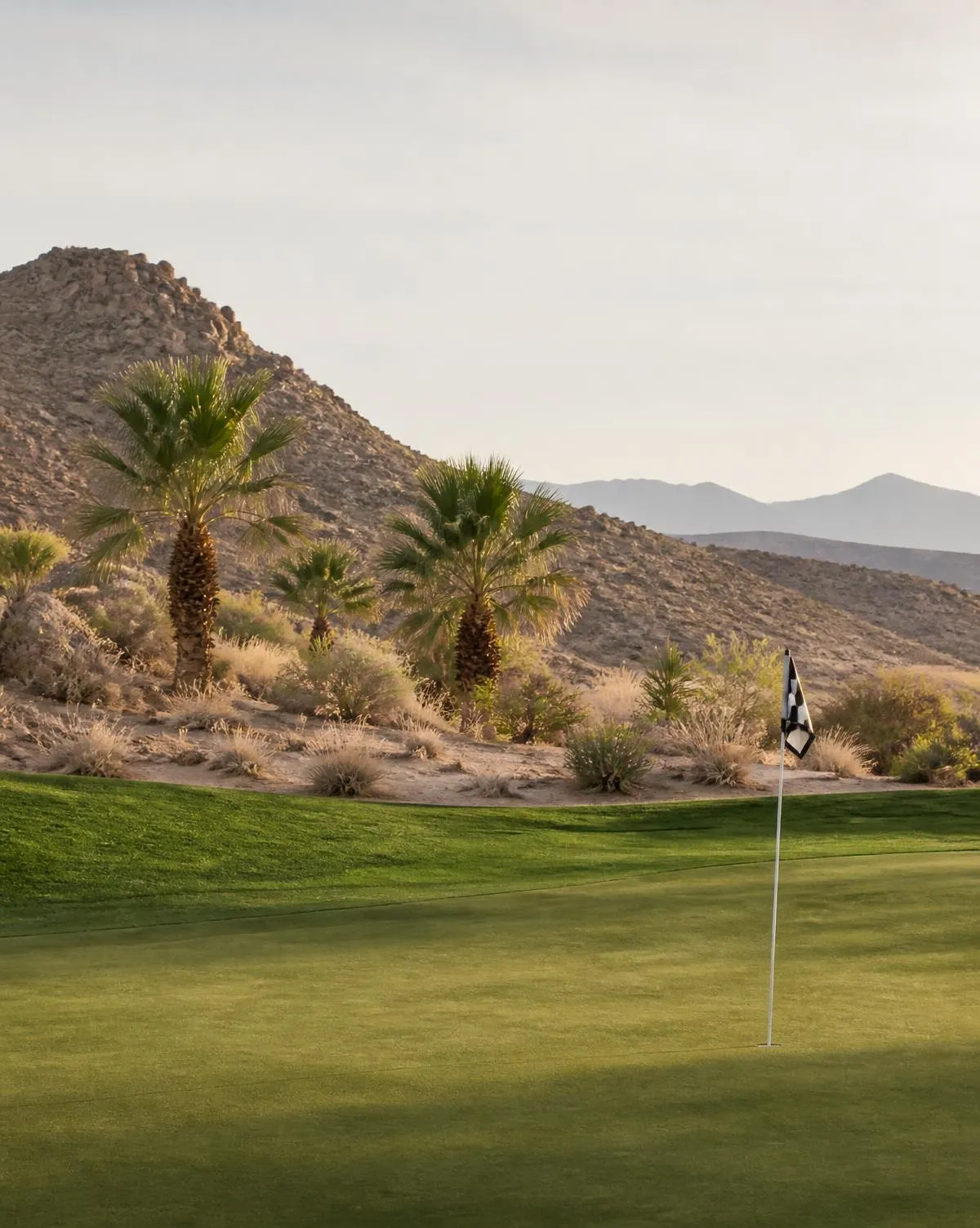 Desert golf course fairway with red rock mountains near Las Vegas