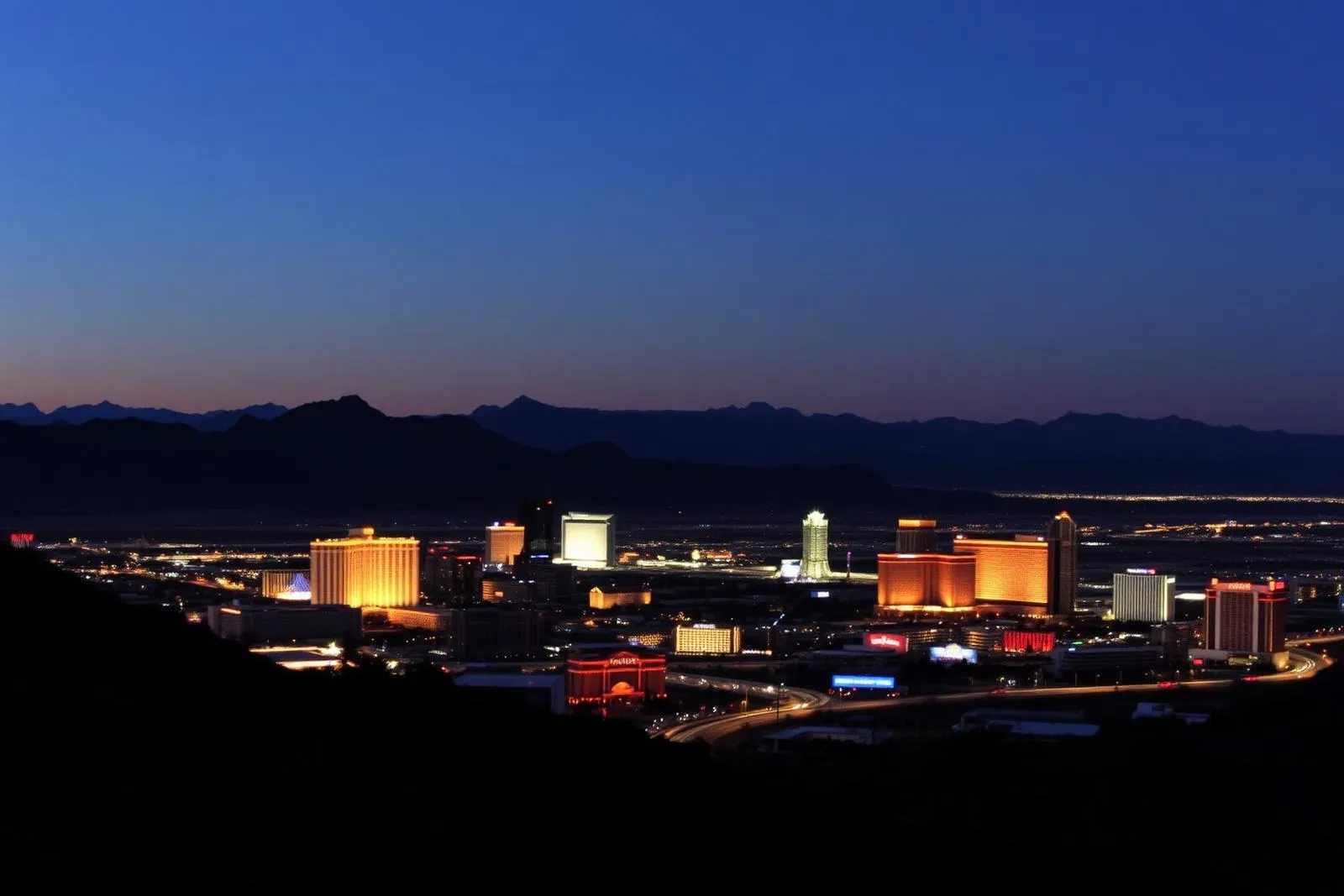 Las Vegas Valley skyline at dusk seen from the surrounding hills